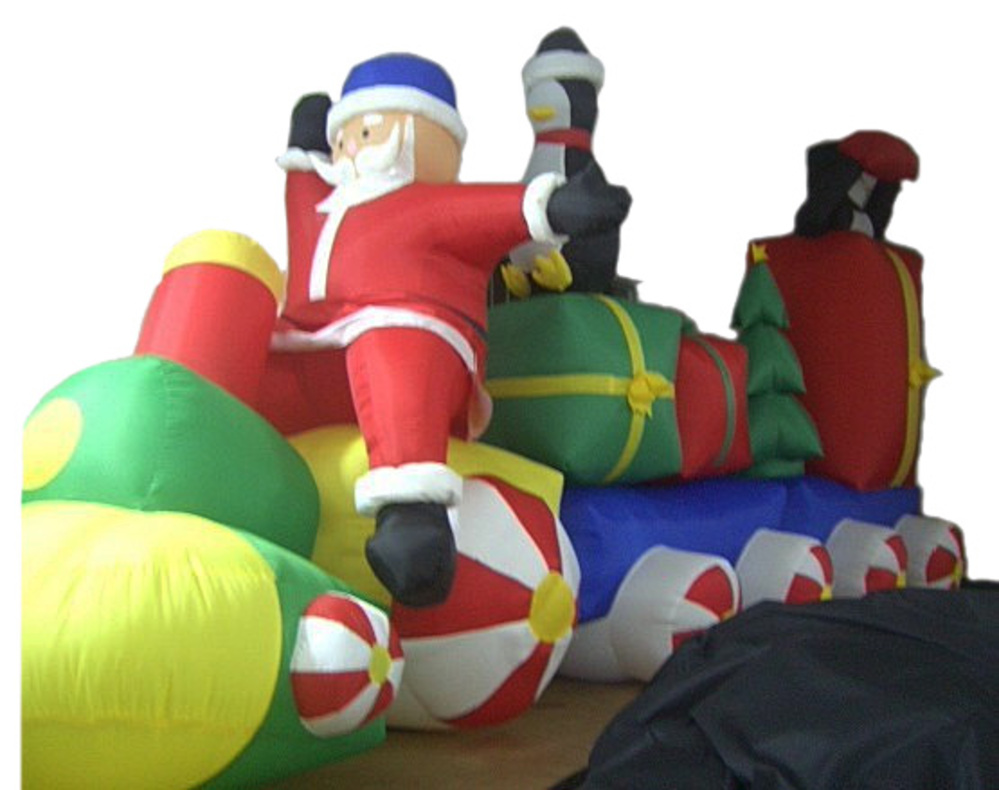 FE10 17 foot long inflatable Santa on a train